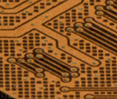Thin traces (wires) on a monolithic flash drive.